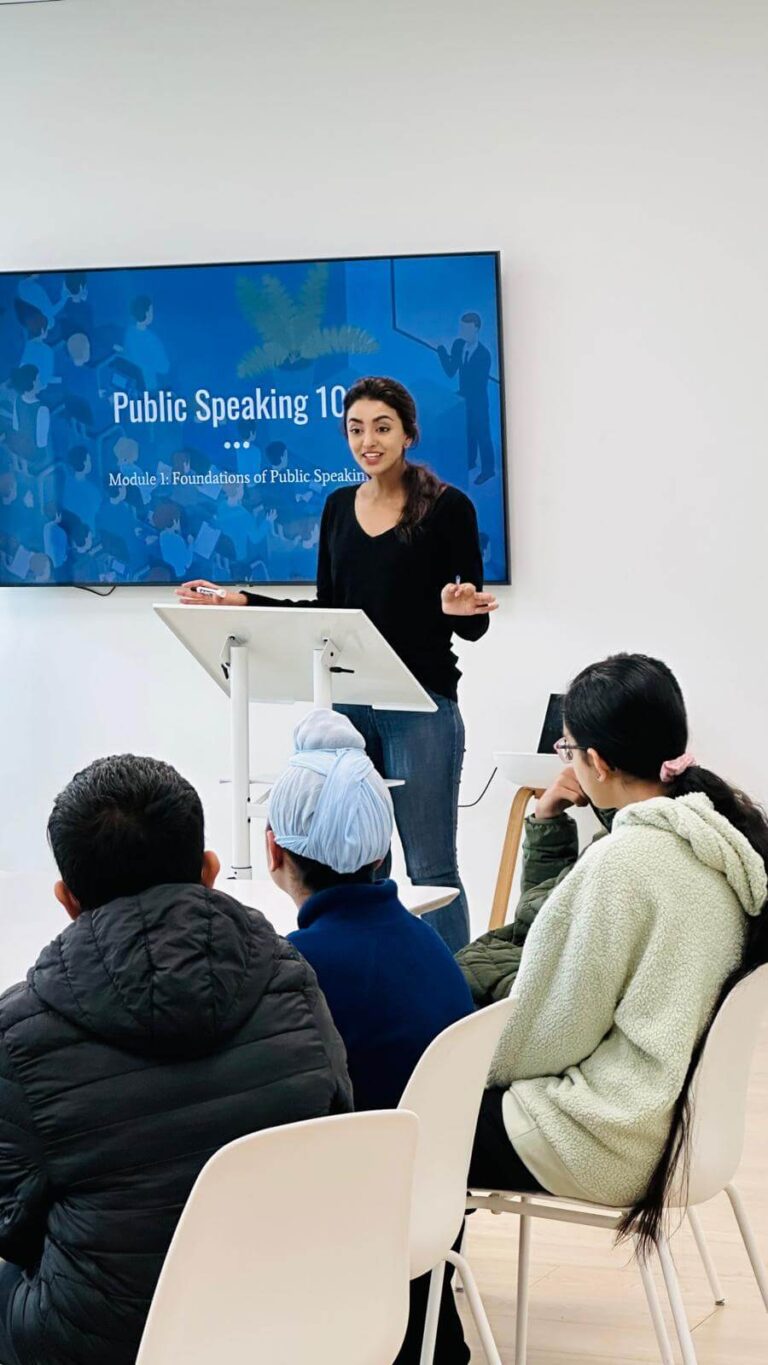 Teacher giving lecture in public speaking classroom